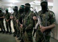 Members of the Ezzedine al-Qassam Brigades, the military wing of the Palestinian Islamist movement Hamas, take part in the funeral of a Palestinian fellow militant in Khan Yunis in the southern Gaza Strip on March 4, 2016
