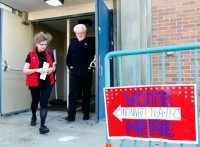 Voters walk out of their precinct after voting as Ohio voters go to the polls for the Ohio primary March 15, 2016 in Cincinnati, Ohio