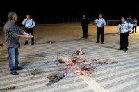 Israeli security forces stand at the scene of a stabbing attack on March 8, 2016 in the neighbourhood of Jaffa in the Israeli city of Tel Aviv as US vice president arrived in the city for a visit
