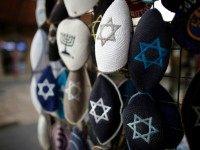 Jewish Kippas (skullcaps) are seen on display at a store in downtown west Jerusalem, on January 15, 2016. Israeli Prime Minister Benjamin Netanyahu, on January 14, addressed the situation of French Jews, by saying 'at the same time every Jew should know that they have a home in Israel and that's a choice that each one of them then makes,' in response to a string of anti-Semitic events in recent months that brought Marseille's top Jewish leader to call on men and boys to stop wearing a kippa.