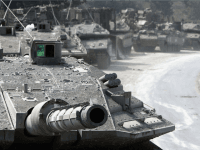 Israeli Merkava tanks and armour wait in a holding area near to the Israeli-Lebanon border as forces move deeper into Lebanon to root out Hezbollah militants carrying out rocket attacks on Israel on July 30, 2006, at a forward base near the northerly town Kiryat Shemona, Israel.