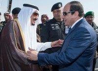 Saudi King Salman (L) greeting Egyptian Presideny Abdel Fattah al-Sisi following the latter's arrival at the King Khalid International airport in Riyadh on November 10, 2015