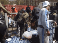 WATCH: South London Residents Pillage Cases Of Water From London Marathon Runners