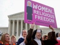 In this March 23, 2016 file photo, nuns and their supporters rally outside the Supreme Court in Washington as the court hears arguments to allow birth control in healthcare plans in the Zubik vs. Burwell case. A seemingly divided Supreme Court is exploring a possible compromise ruling in the dispute between faith-based groups and the Obama administration over birth control.