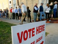 oters line up to cast their ballots on Super Tuesday March 1, 2016 in Fort Worth, Texas.
