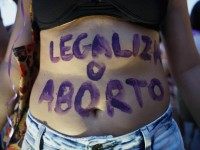 A supporter of legalizing abortion poses during a march for women's rights on International Women's Day on March 8, 2016 in Rio de Janeiro, Brazil.