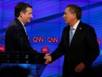 Senator Ted Cruz (C) and Ohio Governor John Kasich (R) shake hands following the CNN Republican Presidential Debate March 10, 2016