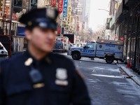 NYPD officers stand guard in Times Square after it was evacuated after a suspicious package call in New York on March 28, 2016.
Investigators from the NYPD determined that the item was in fact a piece of garbage.  / AFP / KENA BETANCUR        (Photo credit should read KENA BETANCUR/AFP/Getty Images)