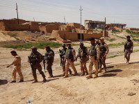 Iraqi soldiers secure an area near the frontline on April 9, 2016 in the town of Kharbardan, located 10 kilometres (6 miles) south of Qayyarah, during military operations to recapture the northern Nineveh province from the Islamic State group's jihadists. 
Iraqi army troops and allied paramilitary fighters on March 24 launched a major offensive aimed at retaking the northern Nineveh province, the capital of which, Mosul, is the main hub of IS in Iraq. Qayyarah is about 60 kilometres (35 miles) south of Mosul.

 / AFP / SAFIN HAMED        (Photo credit should read SAFIN HAMED/AFP/Getty Images)