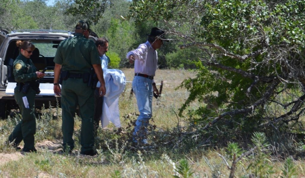 Brooks County Chief Deputy Benny Martinez approaches the body of a deceased woman found after being left behind to die in Brooks County. Border Patrol agents discovered the skeletal remains of what appeared to be a female illegal immigrant. (File Photo: Breitbart Texas/Bob Price)
