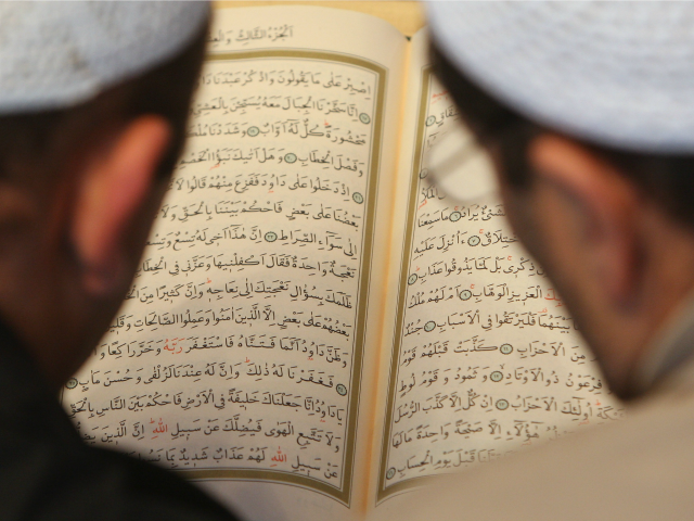 BERLIN - OCTOBER 03: Muslim men study the Koran at the Sehitlik Mosque on open house day at German mosques October 3, 2007 in Berlin, Germany. The day coincides with German unity day (Tag der deutschen Einheit). The Sehitlik Mosque is Berlin's largest and serves a mostly Turkish-speaking congregation.