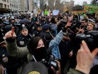 People clash with protesters while they take part in a march against Republican presidential candidate Donald Trump, on March 19, 2016 in New York City.
