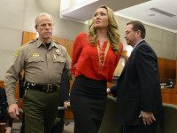 FILE - In this Jan. 15, 2015 file photo, Brianne Altice, 35, center, is taken into custody and ordered to stand trial in 2nd District Court in Farmington, Utah. On Thursday, June 11, 2015, a judge agreed to toss a lawsuit filed against a Utah school district by a teenager who was one of three victims in a teacher sex case involving Altice. The student and his parents had alleged that Davis County School District officials knew the English teacher was behaving inappropriately but didn't do enough to protect students. State attorneys representing the district countered that schools aren't liable for injuries resulting from assaults, including sexual assaults. (Leah Hogsten/The Salt Lake Tribune via AP, Pool, File)
