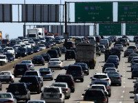 Illinois Might Tax Drivers per Mile -- FILE - In this May 24, 2013 file photo, traffic begins to thicken as motorists getting an early jump to Memorial Day destinations in Indiana and Michigan travel an interstate freeway through Chicago, Illinois . Auto club AAA on Friday, May 16, 2014 said it expects a total of 36.1 million people to travel 50 miles or more this Memorial Day Weekend. If that estimate holds true, it would be the largest amount of people traveling during the holiday weekend since 2005. (AP Photo/Charles Rex Arbogast, File)
