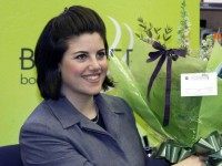 Monica Lewinsky was presented with flowers as she continued to draw crowds, 15 March 1999, when her book signing tour reached Scotland.