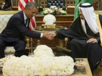 Saudi's newly appointed King Salman (R) shakes hands with US President Barack Obama at Erga Palace in Riyadh on January 27, 2015.