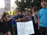 FILE- In this March 24, 2016, file photo, people protest outside the North Carolina Executive Mansion in Raleigh, N.C. A South Carolina proposal to forbid transgender people from using restrooms that correspond to their gender identity is part of a backlash by lawmakers across the historically conservative South. North Carolina passed a law that bans cities and counties from passing anti-discrimination ordinances. (AP Photo/Emery P. Dalesio, File )
