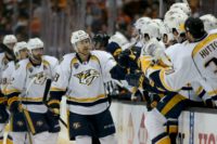 Colin Wilson (C) of the Nashville Predators skates past team's bench after scoring a goal during their NFL first round playoff game against the Anaheim Ducks, at the Honda Center in Anaheim, California, on April 27, 2016