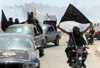 The spokesman for Al-Qaeda's Syrian affiliate, Al-Nusra Front, his son and 20 other jihadists have been killed in air strikes, Syrian Observatory for Human Rights says