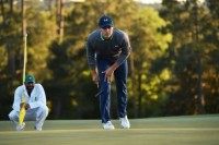 A bogey-double bogey finish by defending champion Jordan Spieth in the third round of the Masters left the 22-year-old American clinging to a one-stroke lead at three-under par 213 after 54 holes