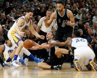 San Antonio Spurs' Manu Ginobili go for a loose ball during the game against the Golden State Warriors at AT&T Center on April 10, 2016