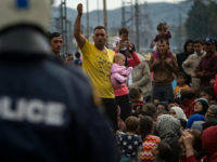 Yazidi refugees protest to call for the reopening of the borders at a makeshift camp at the Greek-Macedonian border near the village of Idomeni on March 21, 2016. Greece will not be able to start sending refugees back to Turkey from March 20, 2016, the government said, as the country struggles to implement a key deal aimed at easing Europe's migrant crisis. / AFP / ANDREJ ISAKOVIC (Photo credit should read ANDREJ ISAKOVIC/AFP/Getty Images)