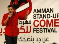 Dean Obeidallah an Arab-American/Italian-American producer and comedian performs at the Amman Stand-Up Comedy Festival in Amman-Jordan, Wednesday night Dec. 9, 2009. (AP Photo/Mohammad Abu Ghosh)