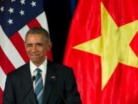 Barack Obama winks as he arrives for a news conference with Vietnamese President Tran Dai Quang, Monday, May 23, 2016, at the International Convention Center in Hanoi, Vietnam.