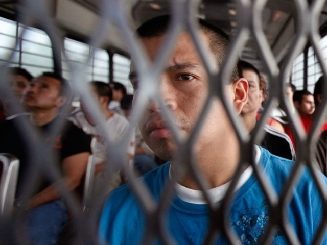 Mario Alberto-Lopez is transported with other undocumented immigrants by U.S. Immigration and Customs Enforcement (ICE) to the airport for a deportation flight May 25, 2010