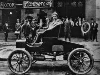 GettyImages-Henry Ford Picture dated 1900 of Henry Ford, attracting the attention of bystanders as he takes the wheel of one of his brand new cars. Henry Ford (1863-1947), US car manufacturer, was the founder of the Ford Motor Company in 1903 and father of modern assembly lines used in mass production. The …