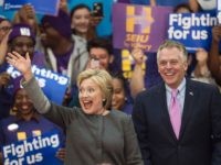 Democratic presidential hopeful Hillary Clinton waves to the crowd beside Virginia Governor Terry McAuliffe during a campaign rally February 29, 2016 at George Mason University in Fairfax, Virginia. / AFP / PAUL J. RICHARDS        (Photo credit should read PAUL J. RICHARDS/AFP/Getty Images)