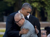 US President Barack Obama hugs Shigeaki Mori (front), a survivor of the 1945 atomic bombing of Hiroshima, during a visit to the Hiroshima Peace Memorial Park on May 27, 2016.
Obama on May 27 paid moving tribute to victims of the world's first nuclear attack.
  / AFP / JIM WATSON        (Photo credit should read