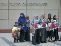 Supporters and family members of Somali men standing trial rally for a protest in front of the United States Courthouse, Monday, May 9, 2016 in Minneapolis. Six defendants have pleaded guilty to conspiring to provide material support to the Islamic State group. Three defendants have pleaded not guilty. Another man is at large, believed to be in Syria. (Elizabeth Flores/Star Tribune via AP) MANDATORY CREDIT