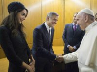 Pope Francis meets George Clooney and his wife Amal at the Vatican meeting (L'Osservatore Romano/Pool photo via AP)