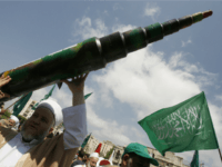 A man holds a mock Qassam rocket during a rally organised by Lebanese and Palestinian supporters of the Islamist movement Hamas and the Islamic Group, Jamaa Islamiya in solidarity with Palestinians in the Gaza strip where Hamas is engaged in a major confrontation with the Israeli army on July 11, 2014 in the southern Lebanese city of Sidon.