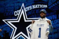 Ezekiel Elliott of Ohio State holds up a jersey after being picked #4 overall by the Dallas Cowboys during the first round of the 2016 NFL Draft on April 28, 2016 in Chicago, Illinois