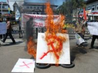 An anti-communism group holds a rally in Bandung, West Java province, Indonesia