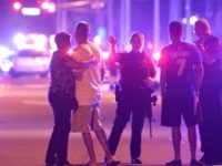 Orlando Police officers direct family members away from a fatal shooting at Pulse Orlando nightclub in Orlando, Fla. June 12, 2016.