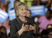 Democratic presidential candidate Hillary Clinton gestures as she "sighs" talking about Republican presidential candidate Donald Trump during a rally in Raleigh, N.C., Wednesday, June 22, 2016. (AP Photo/Chuck Burton)