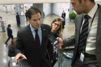 Sen. Marco Rubio of Fla. speaks with reporters while he walks through the Capitol in Washington, Tuesday, June 28, 2016. (AP Photo/Cliff Owen)