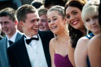 NEWCASTLE, UNITED KINGDOM - JULY 01:  Matthew Rayner and Erin Bowmaker pose for pictures with school friends before catching the bus to the school prom on July 1, 2011 in Newcastle, United Kingdom. After months of preparation more than 200 final year students aged 15 to 16 from Cramlington Learning Village attended a leaver's prom at St James Park, Newcastle. The prom marks the end of GCSE examinations and the completion of their high school studies.  (Photo by Bethany Clarke/Getty Images)
