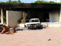 A burnt house and a car are seen inside the US Embassy compound on September 12, 2012 in Benghazi, Libya following an overnight attack on the building. The US ambassador to Libya and three of his colleagues were killed in an attack on the US consulate in the eastern Libyan city by Islamists outraged over an amateur American-made Internet video mocking Islam, less than six months after being appointed to his post. AFP PHOTO/STRINGER (Photo credit should read