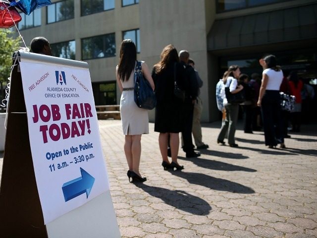 Job seekers line up to enter a job fair at the Alameda County Office of Education on April 24, 2013 in Hayward, California. Over 100 job seekers attended the annual education job fair hosted by the Alameda County Office of Education where 200 jobs were available ranging from teachers to IT professionals. (Photo by)