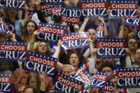 PROVO - MARCH 19: Supporters wave signs as Republican presidential candidate Sen. Ted Cruz (R-TX) speaks at a campaign rally on March 19, 2016 in Provo, Utah. The Republican and Democratic caucus will be held in Utah on Tuesday March 22, 2016. (Photo by George Frey/Getty Images