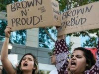 SAN JOSE, CA - JUNE 02: Protesters hold up signs that say "Brown n' Proud" outside a campaign rally for Republican Presidential candidate Donald Trump on June 2, 2016 in San Jose, California. Trump is campaigning in California ahead of the states June 7th Republican primary. (Photo by