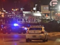 Lights from police vehicles light up the scene infront of the Pulse club in Orlando, Florida on June 12, 2016.