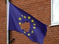 KNUTSFORD, UNITED KINGDOM - JUNE 24:  A European Union flag, with a hole cut in the middle, flys at half mast outside a home in Knutsford Cheshire after today's historic referendum on June 24, 2016 in Knutsford, United Kingdom. The results from the historic EU referendum has now been declared and the United Kingdom has voted to LEAVE the European Union.  (Photo by )