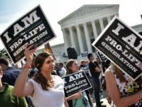 nti-abortion activists hold placards before a US Supreme Court ruling on a Texas law placing restrictions on abortion clinics, outside of the Supreme Court on June 27, 2016 in Washington, DC. In a case with far-reaching implications for millions of women across the United States, the court ruled 5-3 to strike down measures which activists say have forced more than half of Texas's abortion clinics to close.