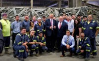 MONESSEN, PA - JUNE 28: Presumptive Republican candidate for President Donald Trump gathers for a photo with employees during a campaign stop at Alumisource on June 28, 2016 in Monessen, Pennsylvania. Trump continued to attack Hillary Clinton while delivering an economic policy speech targeting globalization and free trade. (Photo by Jeff Swensen/Getty Images)