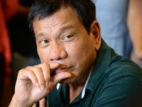 PHILIPPINES, DAVAO : Philippine President-elect Rodrigo Duterte speaks during his first press conference since he claimed victory in the presidential election, at a restaurant in Davao City, on the southern island of Mindanao on May 15, 2016. Duterte vowed on May 15 to reintroduce capital punishment and give security forces "shoot-to-kill" orders in a devastating war on crime. / AFP PHOTO / TED ALJIBE